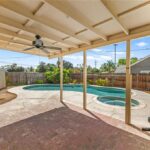 California real estate home patio with pool, spa, and fenced yard